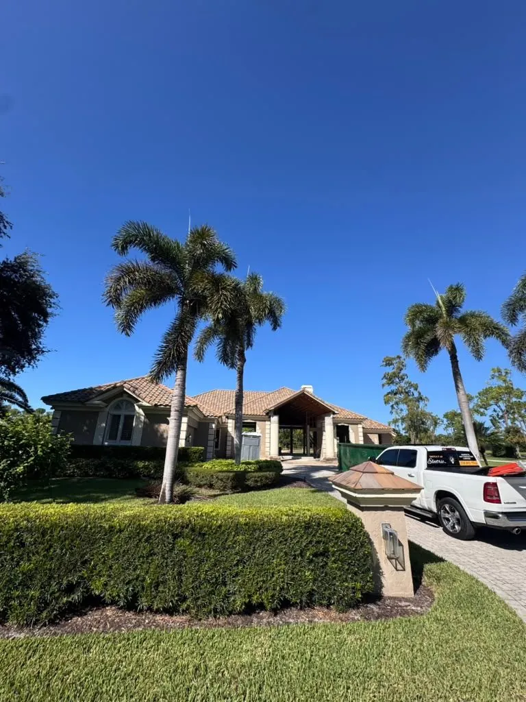 New tile-roof custom home under construction in Southwest Florida with the Switch It Up Electric truck in the driveway